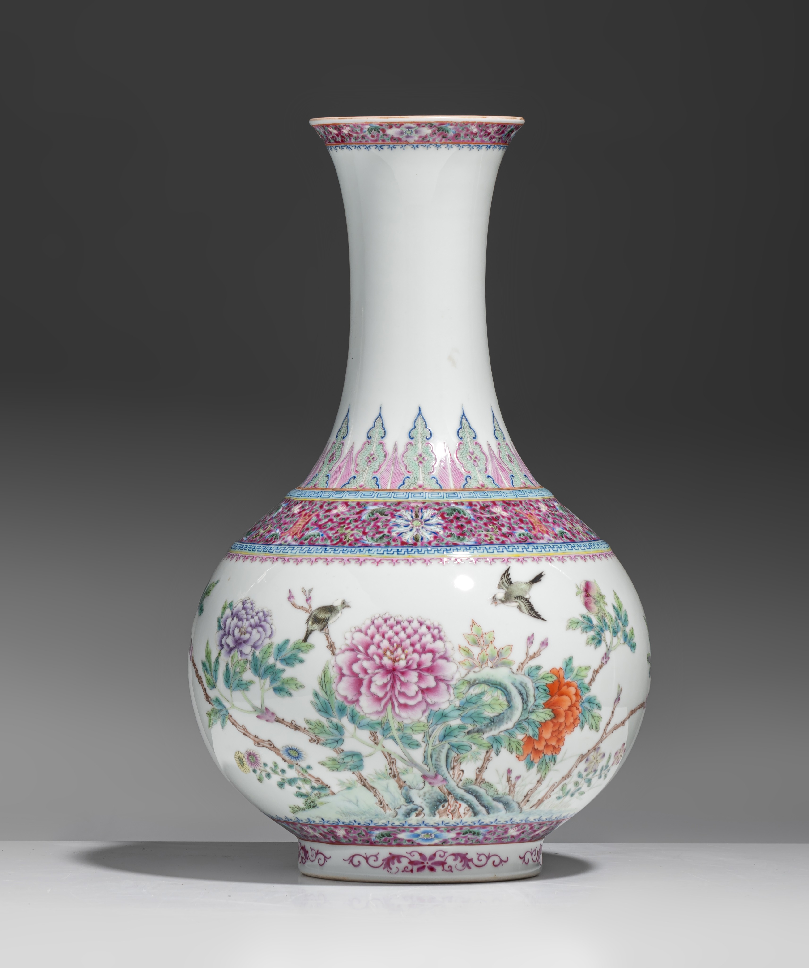 A fine Chinese famille rose 'Birds and Flowers' bottle vase, with a Qianlong mark, Republic period,