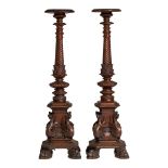 A pair of richly carved walnut pedestals, H 172 cm