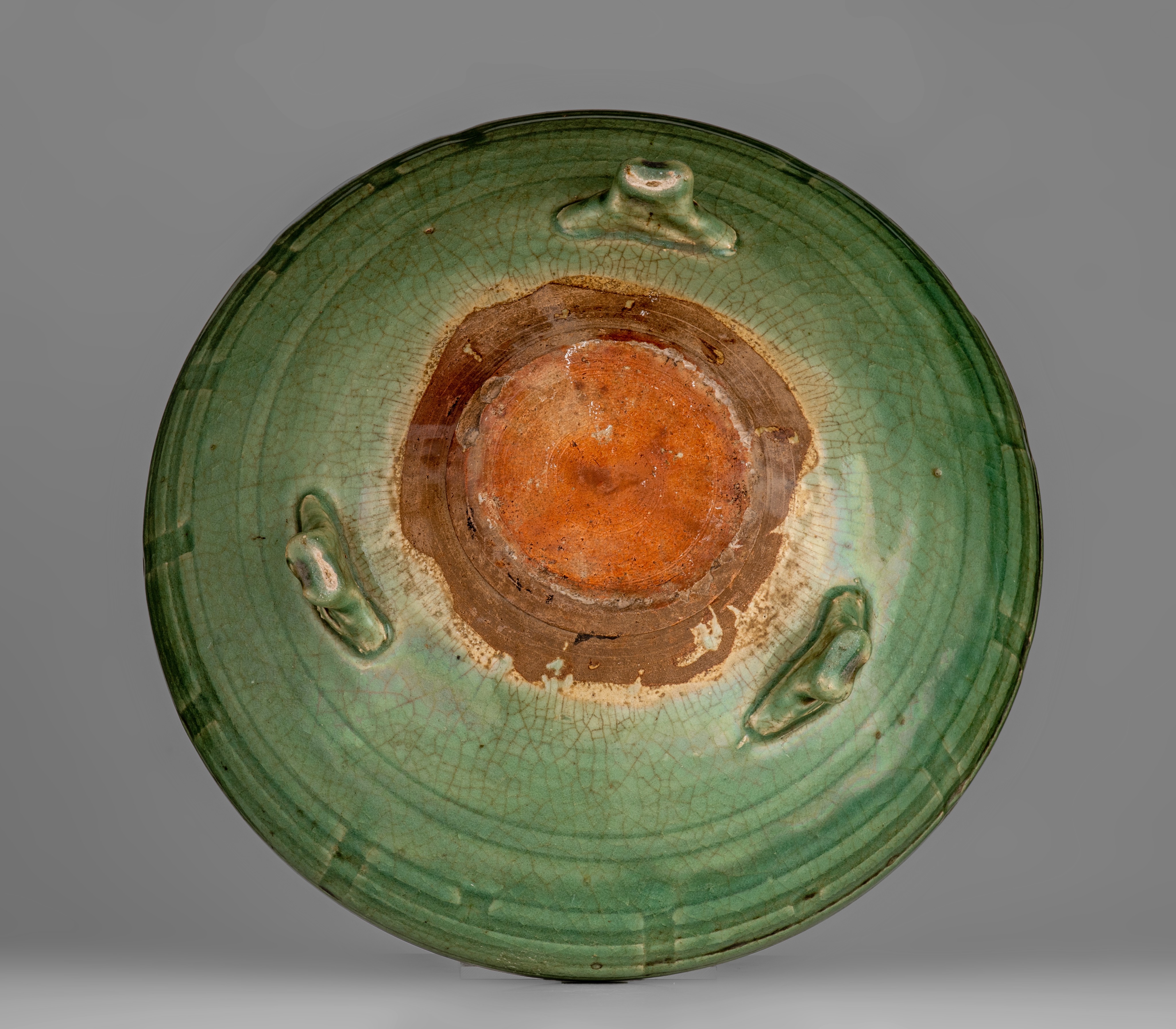 A Chinese longquan celadon tripod censer, late Yuan dynasty, ø 34 - H 11,5 cm - Image 10 of 20