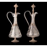 A pair of glass, silver-plated brass mounted decanters, H 41 - 42 cm