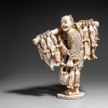 A Japanese ivory okimono of a fisherman and his wares, Meiji/early Taishô, H 20 cm, 769 g (+)