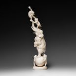 A Japanese ivory okimono of a circus performance with animals, early Meiji, H 26,6 cm, 376 g (+)