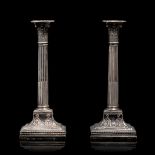 A pair of English sterling silver Neoclassical column-shaped candlesticks, hallmarked Sheffield, H 3
