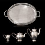 A silver Empire-style three-part coffee and tea set, 950/000, on a matching plate, 835/000