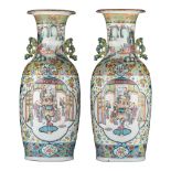 A pair of Chinese famille rose 'Court scene' vases, paired with lingzhi handles, 19thC, H 61 cm