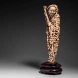 A Chinese ivory figure of an Immortal, late Qing/Republic period, H 28 cm - 1058 g (base incl.) (+)