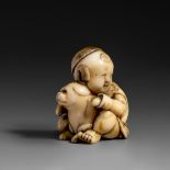 A Japanese ivory netsuke of a boy and his puppy, W 2,7 cm - D 3 cm - H 3,6 cm, 23 g (+)