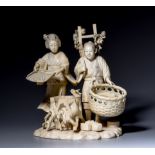 A Japanese ivory okimono of a farmers couple, early Meiji period, H 16,7 cm, 714 g (+)