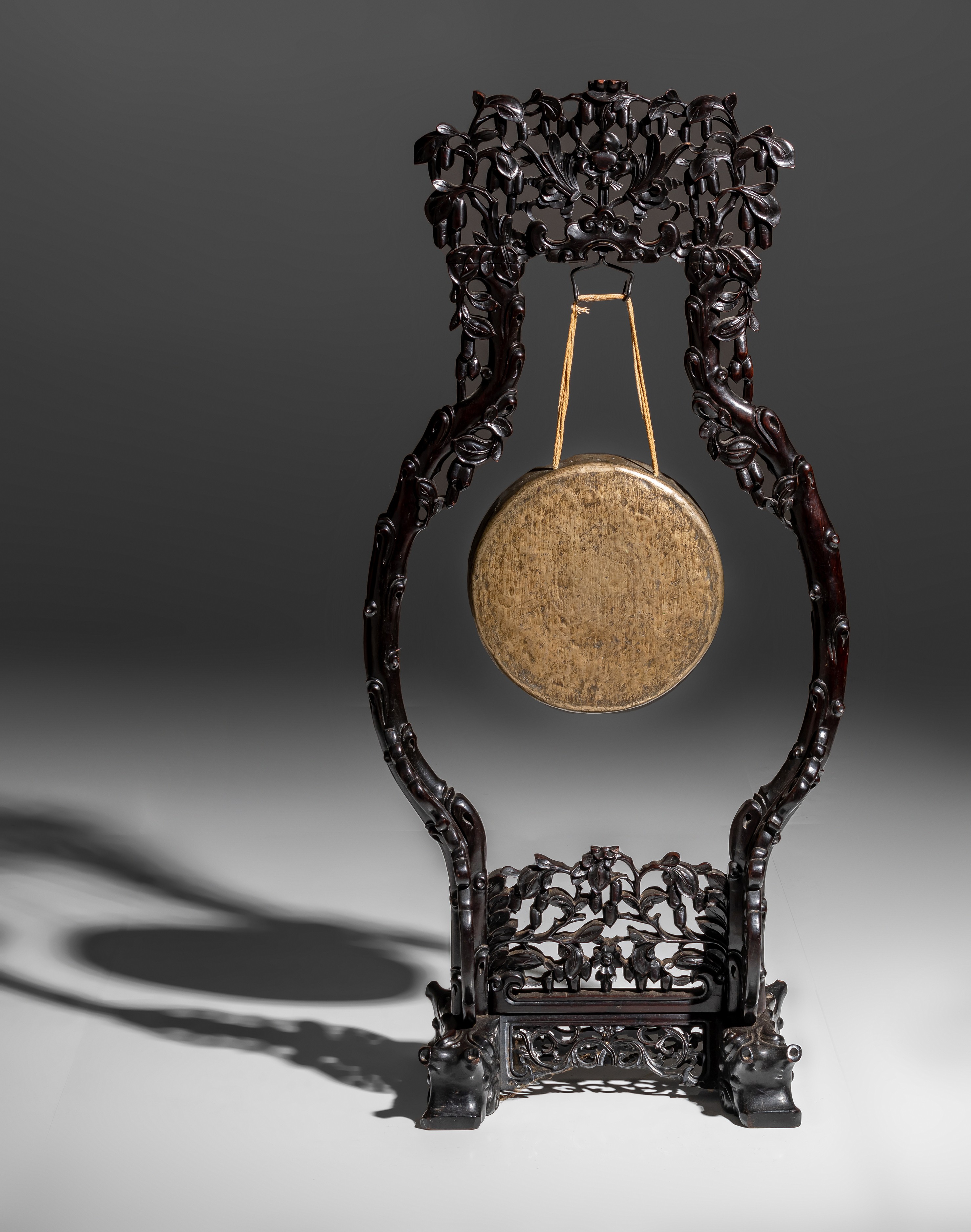 A Chinese gong on a finely carved rosewood stand, late Qing, H 127,3 - W 58,5 cm - Image 4 of 8