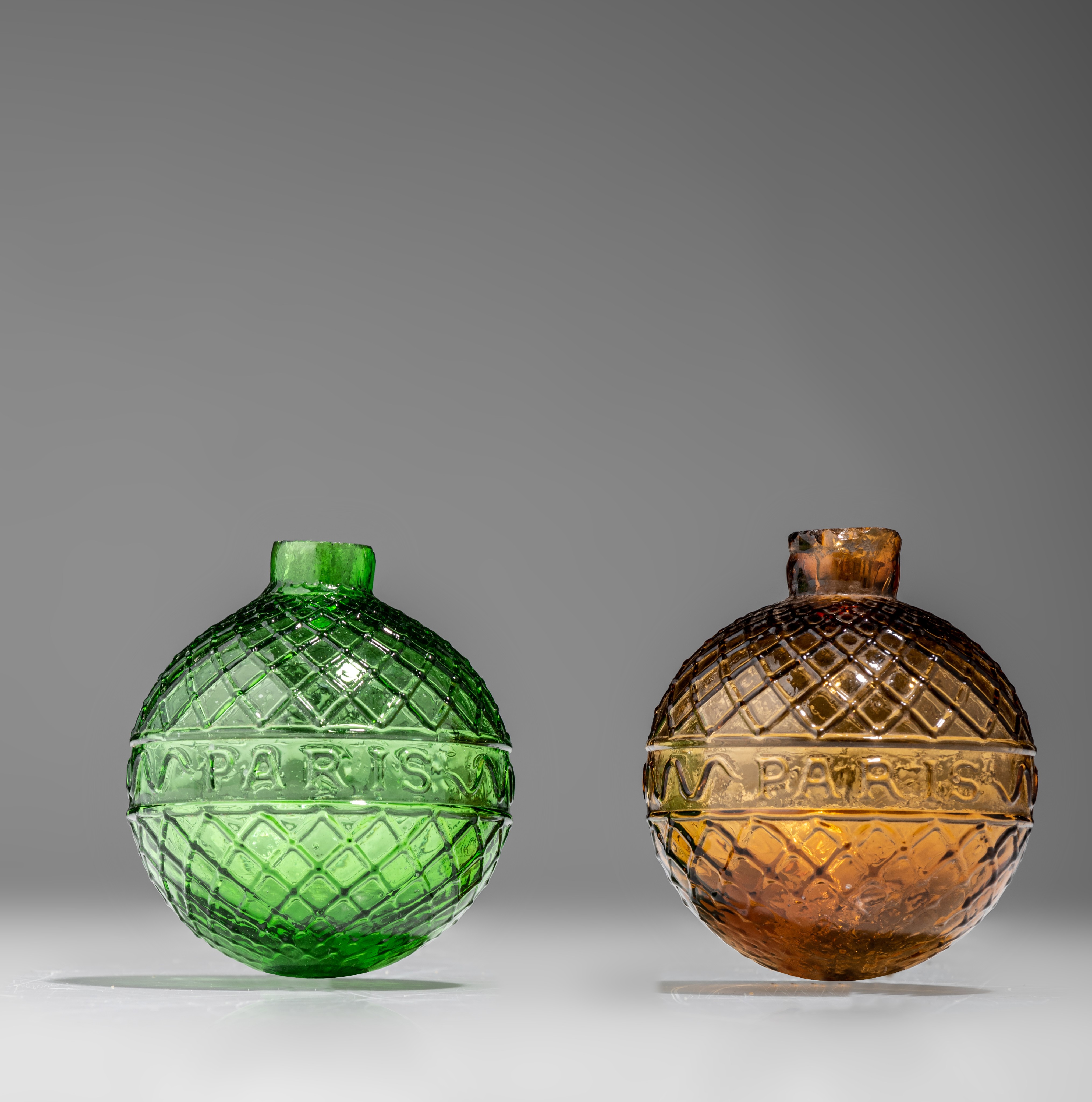 Two target balls, green and amber-coloured moulded glass, marked Gevelot - Paris, 1875-1900, H 7 cm - Image 3 of 9