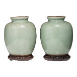 A pair of Chinese celadon glazed vases, late 19thC/Republic period, H 29 cm