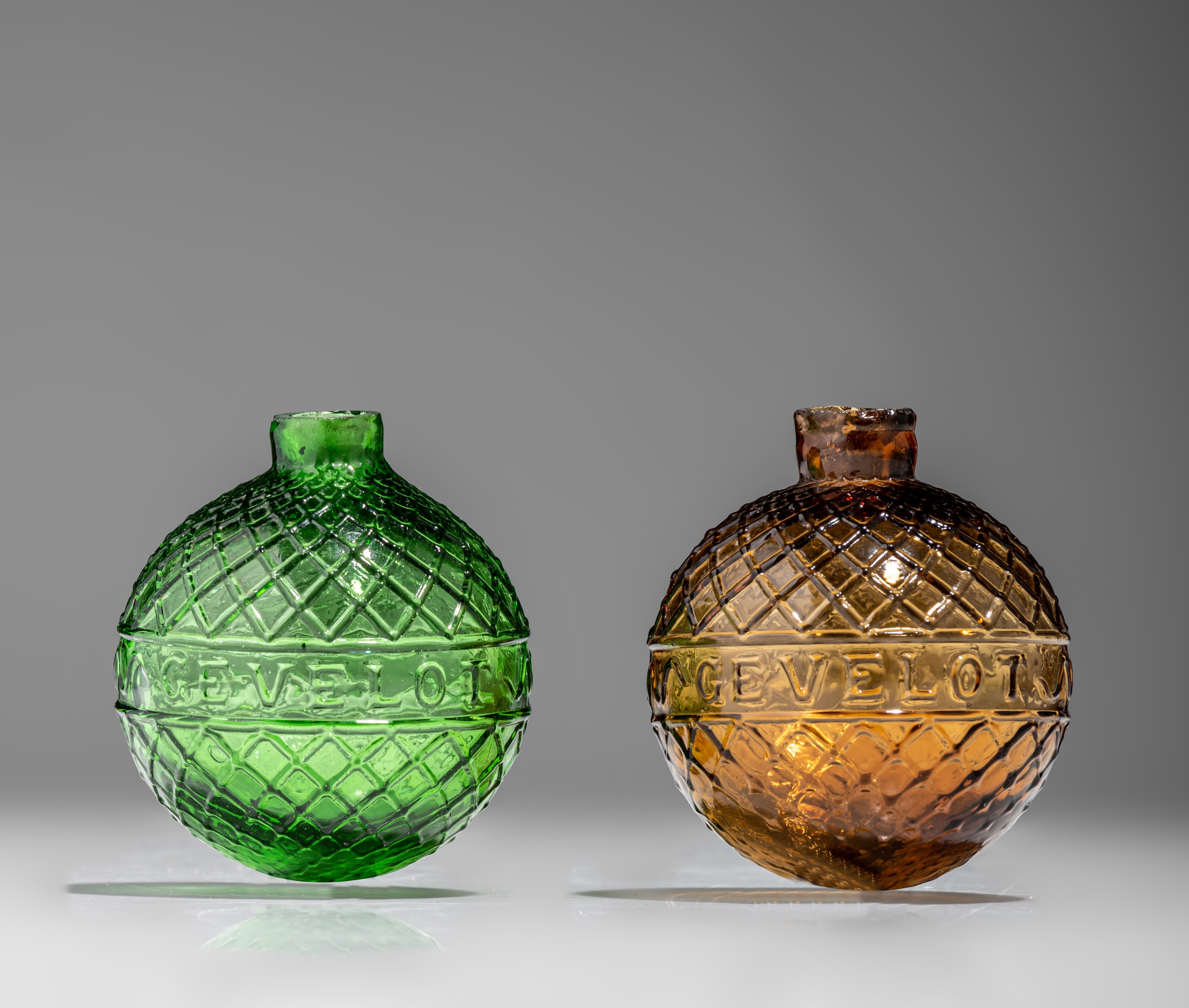 Two target balls, green and amber-coloured moulded glass, marked Gevelot - Paris, 1875-1900, H 7 cm - Image 6 of 9