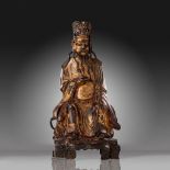 A Chinese gilt lacquered bronze figure of a dignitary, Ming period, Weight about 3.000 g - H 34 cm