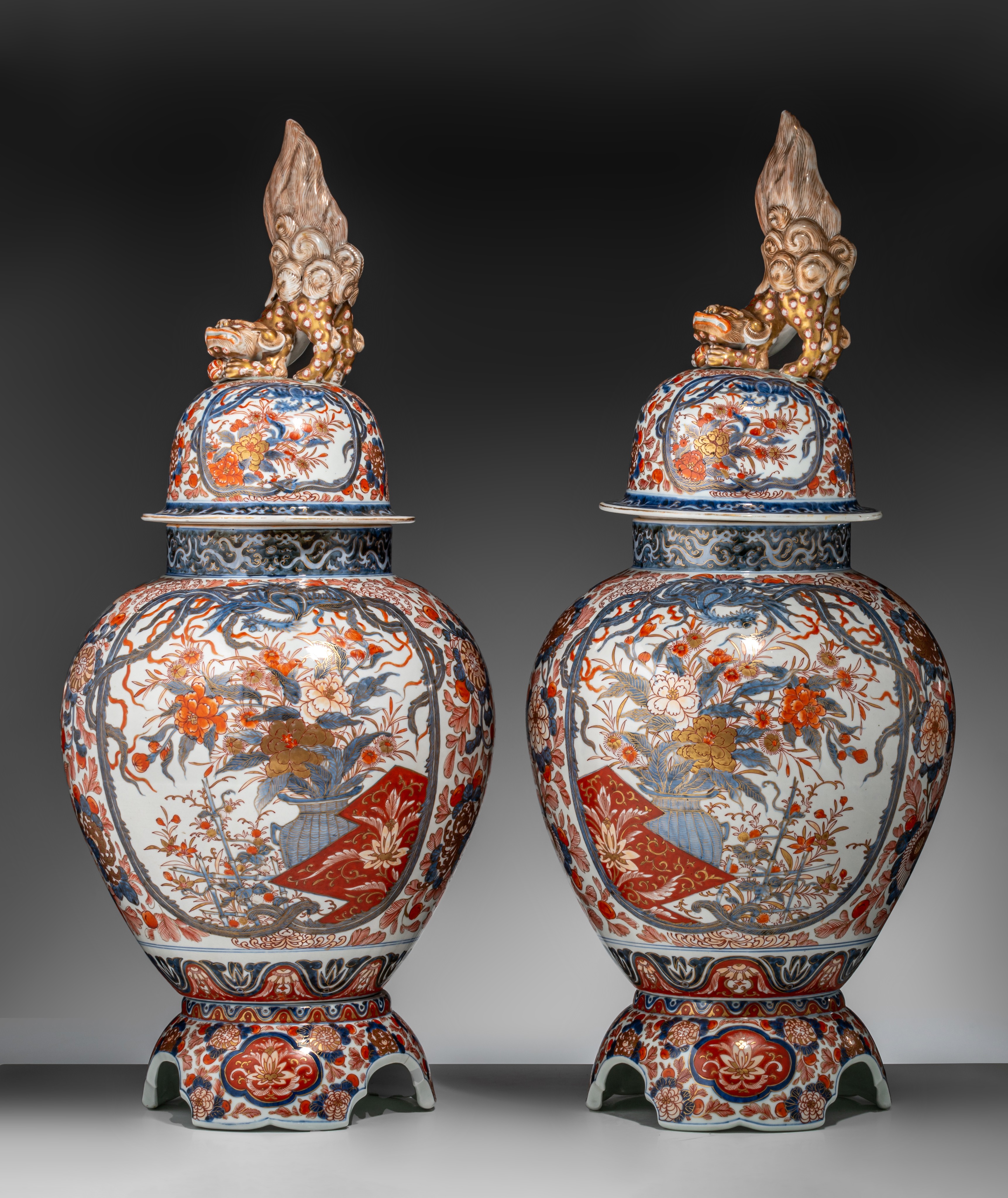 A pair of Japanese Imari covered vases, on a porcelain base, early Meiji, Total H 82,5 cm - Image 2 of 17