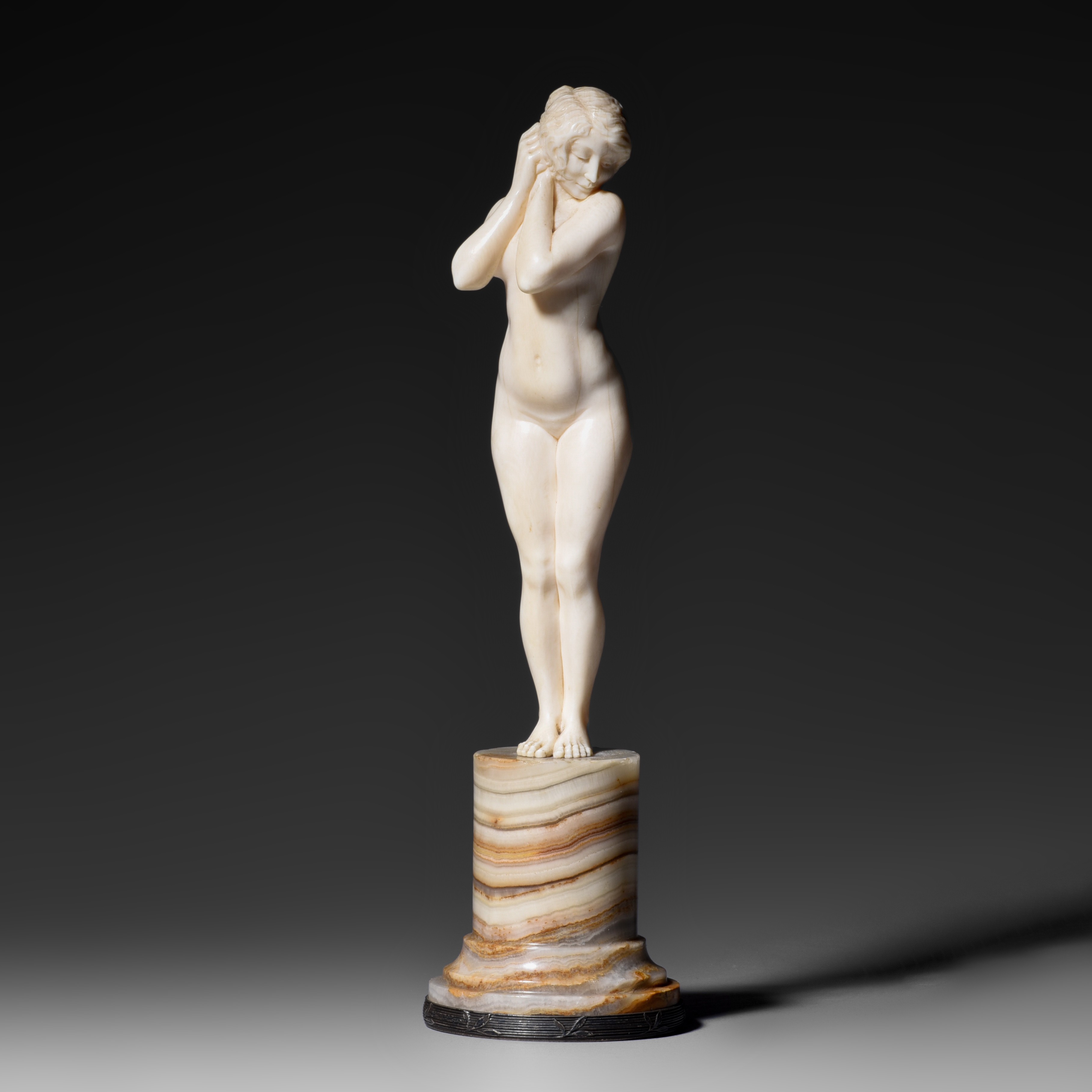 An Art Deco ivory female nude mounted on an onyx base, signed J. Bertrand, H 16,2 cm - 117g (+)