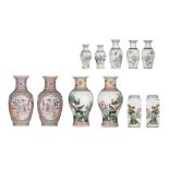 A collection of Chinese famille rose vases, multiple pairs, some with a text, 20thC, H 17,5 - 36 cm