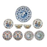 A large 18thC Delft Wanli-type charger, added Delft plates and bowls, ø 16 - 40 cm