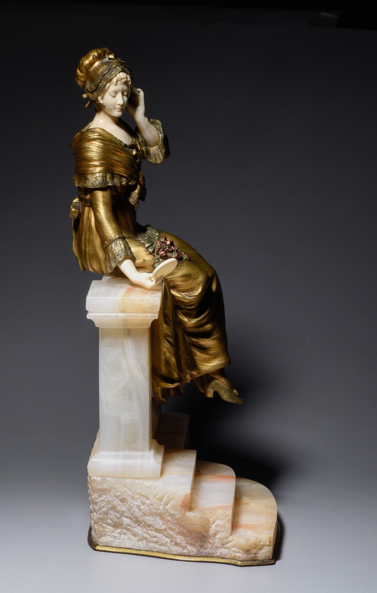 A chryselephantine, polychrome gilded bronze and ivory, H 40,5 cm (incl. base) (+) - Image 5 of 5