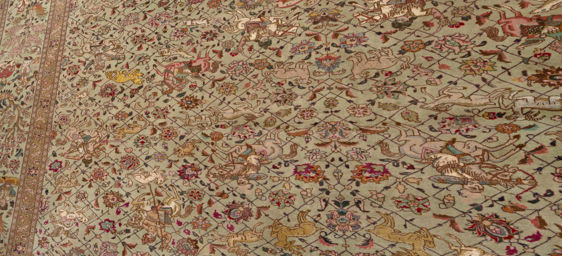 A large Oriental carpet decorated with hunting scenes to the field, 303 x 385 cm - Image 7 of 8