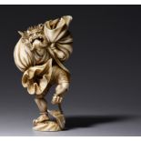 A Japanese ivory okimono depicting Oni, late Edo/early Meiji period, H 12,5 cm, 210 g (+)