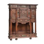 A richly carved oak Renaissance Revival credence, H 185 - W 155 - D 55 cm