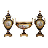 A three-piece Sèvres garniture set, decorated with gallant scenes, signed 'J. Césana', H 28,5 - 42,5