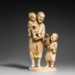 A Japanese ivory okimono of a fisherman and his children, Meiji period, H 22,5 cm, 841g (+)