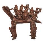 A Chinese hardwood carving of 'Immortals on a Gui dragon', H 47 - W 56 - D 29 cm