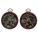 A pair of Chinese bone carvings on round panels, late Qing/Republic period, largest ø 37 cm