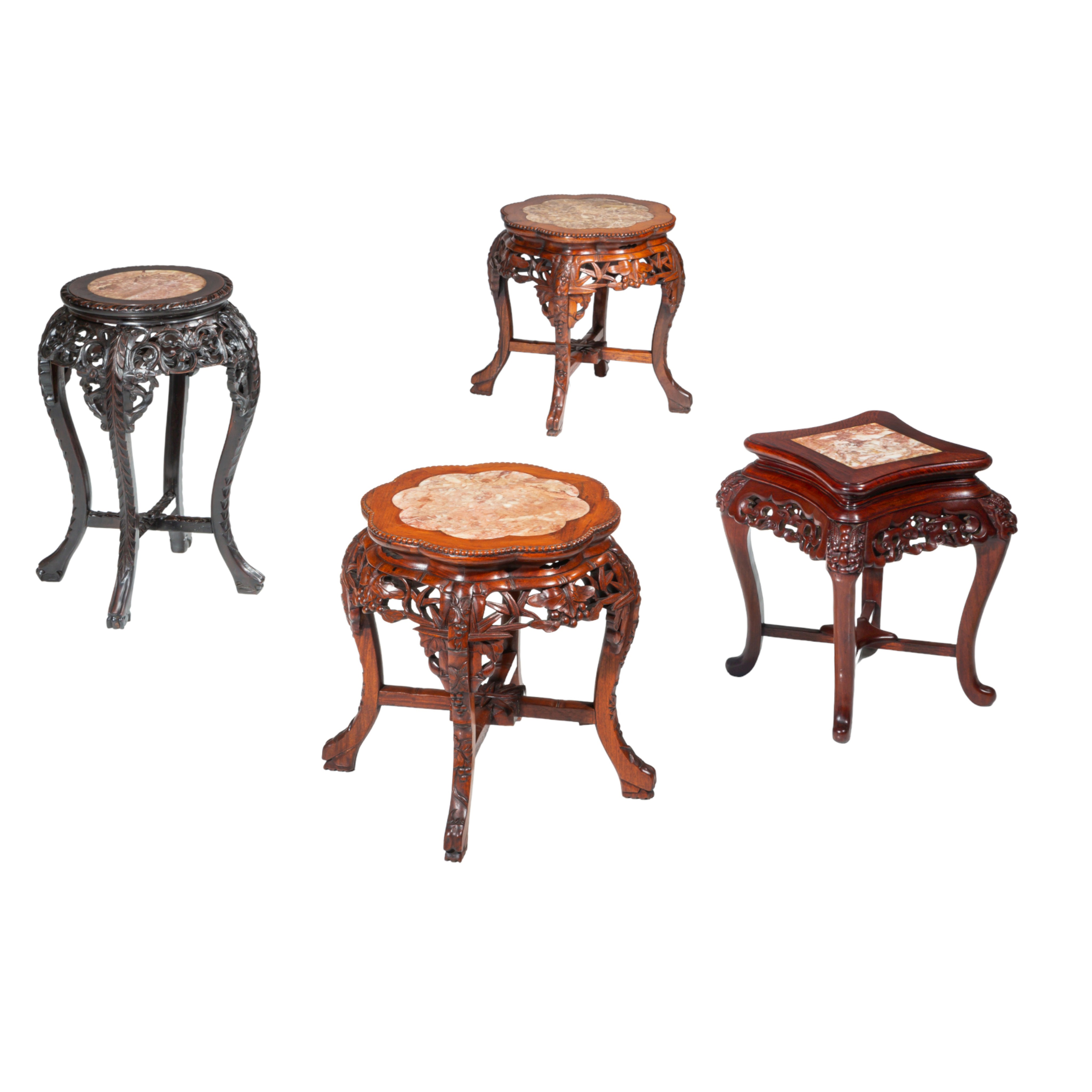 A collection of four carved low hardwood stands, with marble tops, late Qing, tallest H 61,5 cm (4)