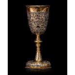 An 18th-century Russian silver and parcel-gilt goblet set with silver open-work appliqué, H 15,8 cm,