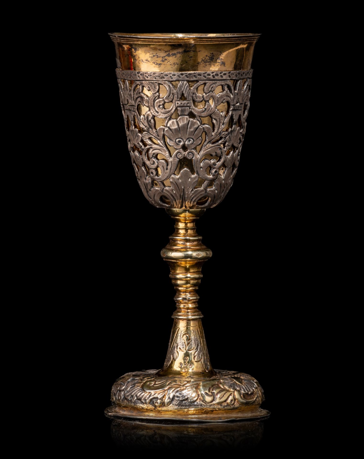 An 18th-century Russian silver and parcel-gilt goblet set with silver open-work appliqué, H 15,8 cm,