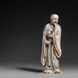 A Japanese ivory okimono of an Immortal, late Edo/early Meiji period, H 18,2 cm, 395 g (+)