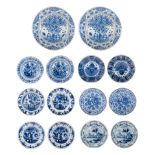 A pair of 18thC Delft plates by Geertruy Verstelle, added 12 blue and white plates, ø 16 - 34 cm