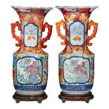 A pair of Japanese Imari vases, paired with stylised dragon handles, with an atelier mark, late Meij