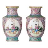 A pair of Chinese famille rose baluster vases, with a Qianlong mark, 20thC, H 28,3 cm