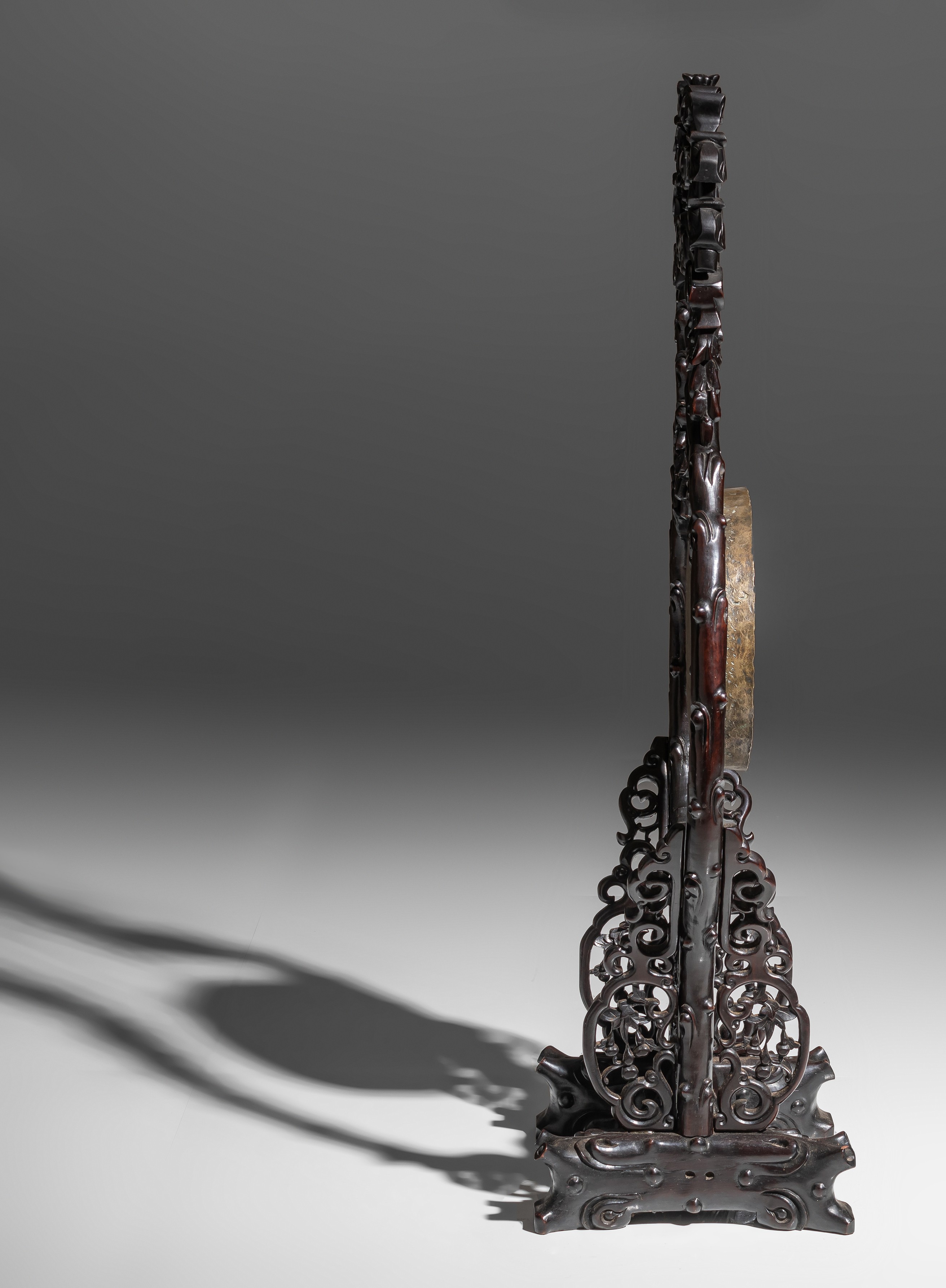 A Chinese gong on a finely carved rosewood stand, late Qing, H 127,3 - W 58,5 cm - Image 5 of 8