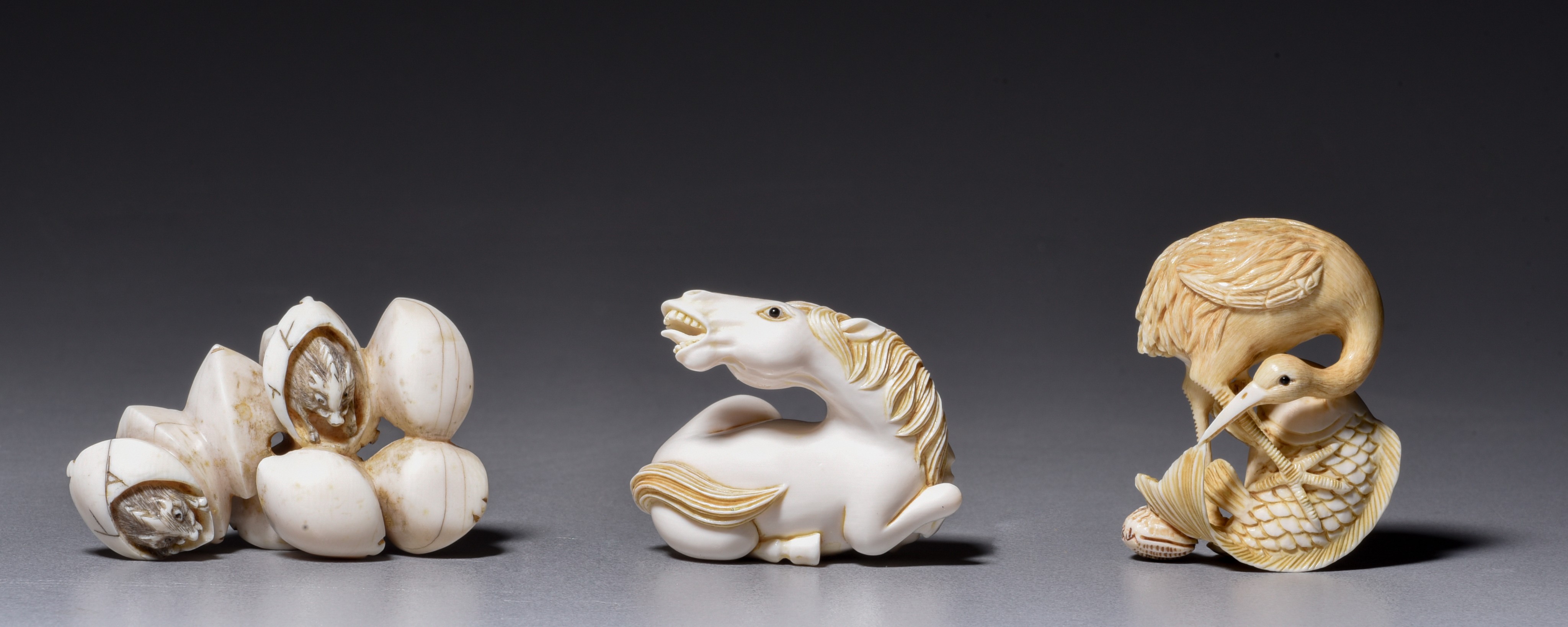 Two ivory netsuke, W 4,2 - 5,2 cm, 19 - 21 g.; one ditto okimono H 4,5 cm - 16 g (+)