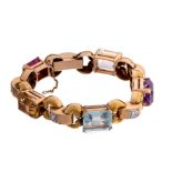 A bracelet in 18ct yellow gold, set with semi-precious stones and diamonds, 45,5 g