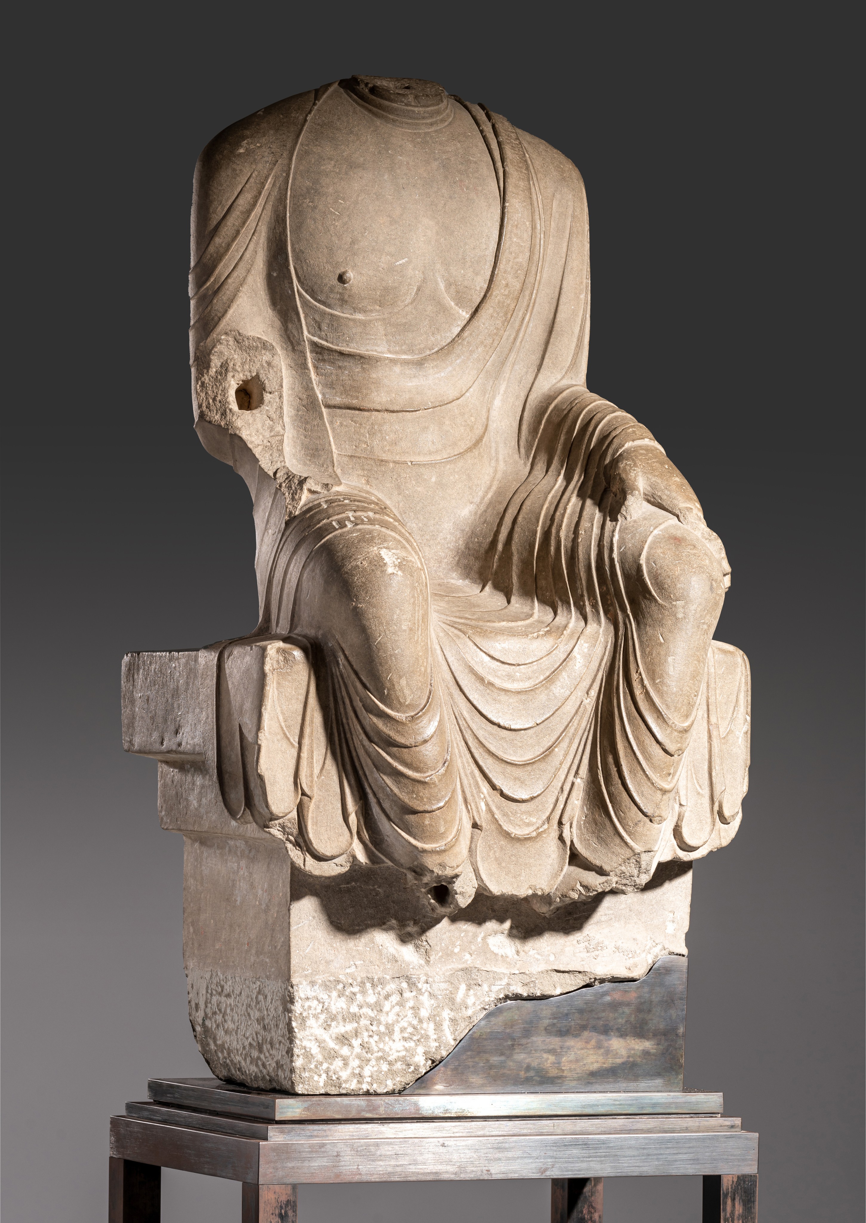 PREMIUM LOT - Full registration and deposit is needed. A Chinese grey limestone figure of a seated