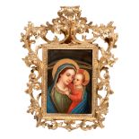 A finely painted KPM porcelain plaque of the Madonna and Child, in a richly decorated frame, late 19