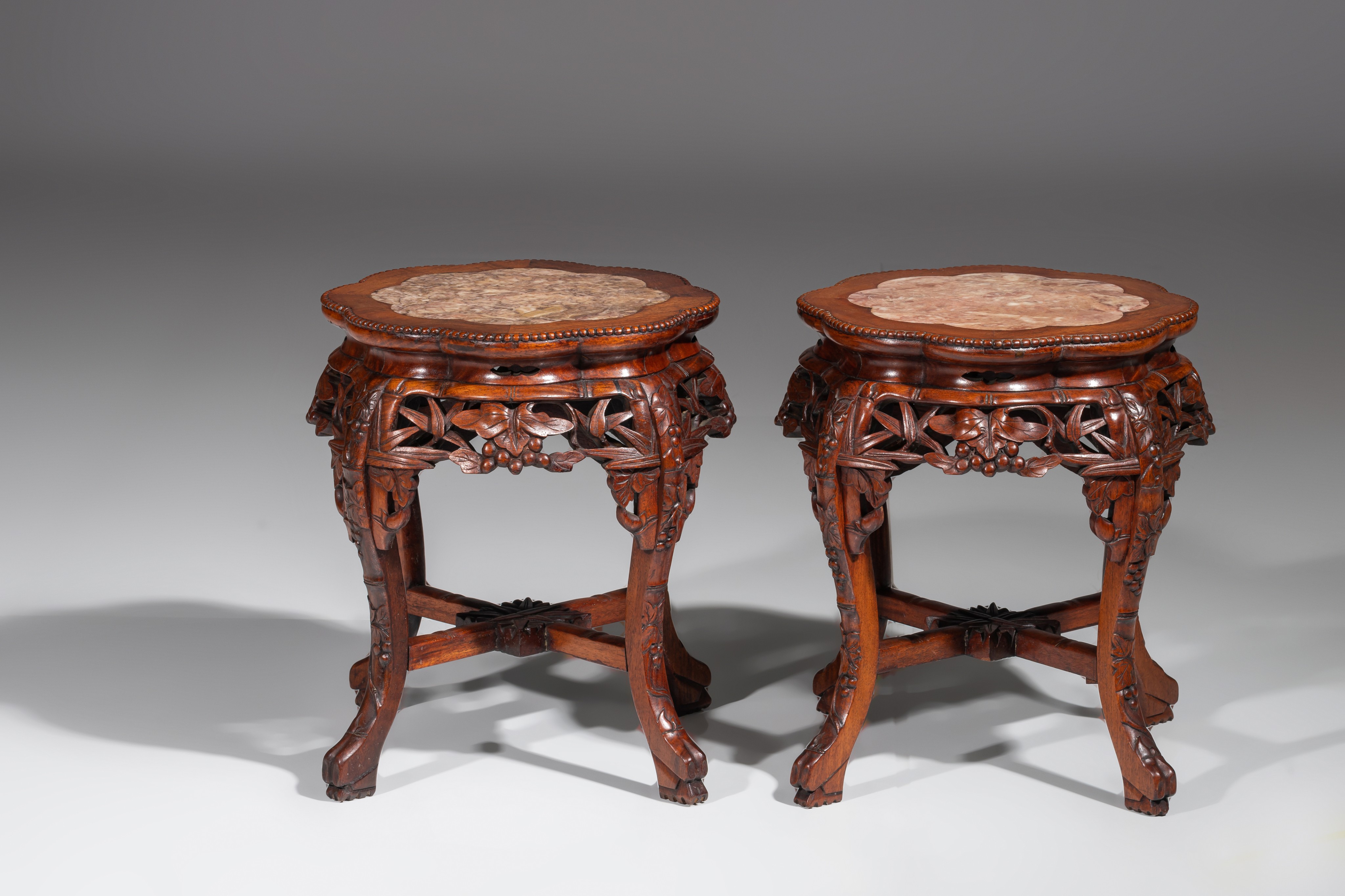 A collection of four carved low hardwood stands, with marble tops, late Qing, tallest H 61,5 cm (4) - Image 12 of 13