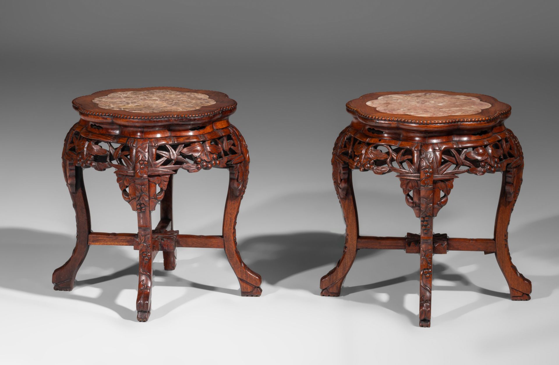 A collection of four carved low hardwood stands, with marble tops, late Qing, tallest H 61,5 cm (4) - Image 8 of 13