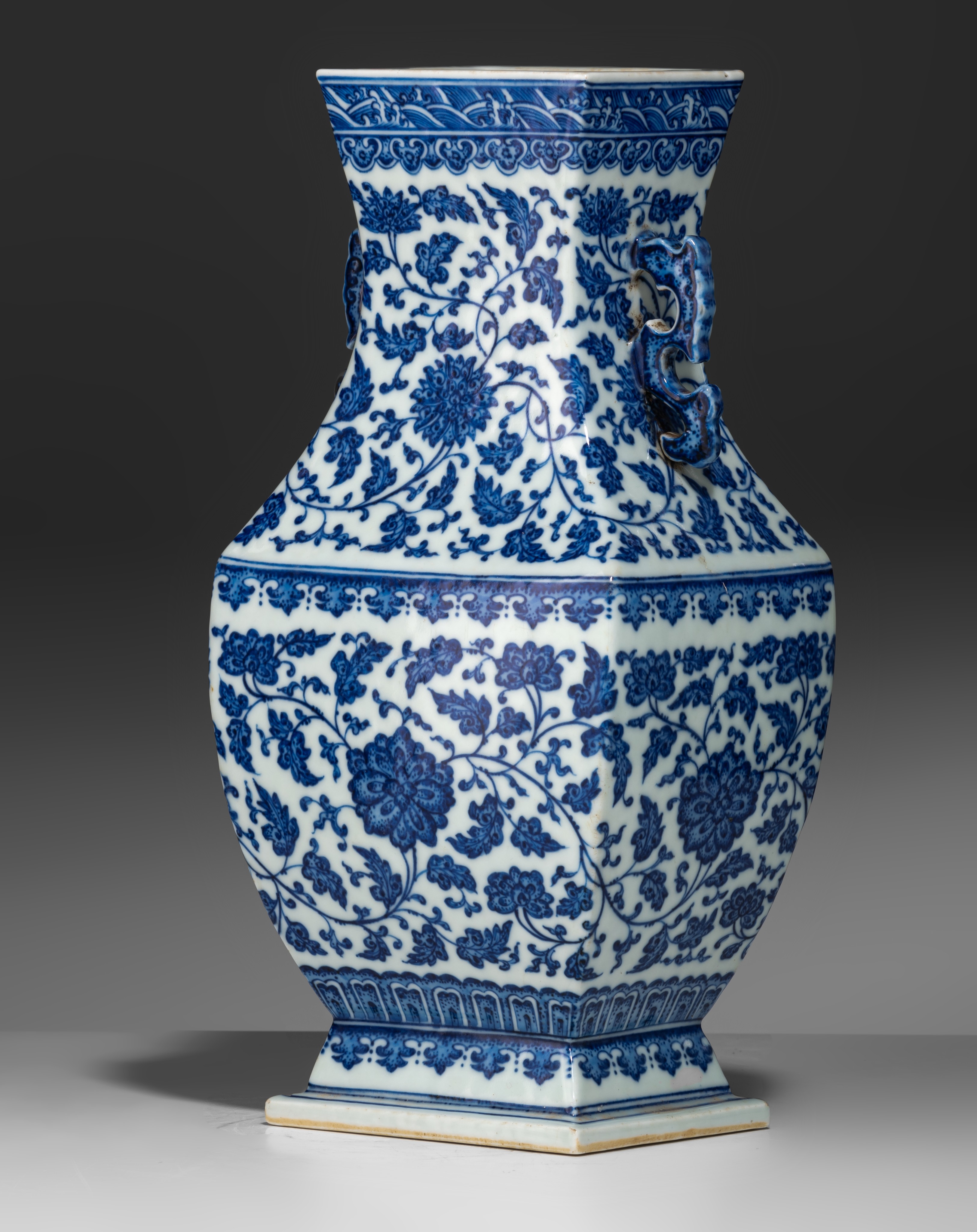 A Chinese blue and white 'Lotus scrolls' fanghu vase, paired with dragon handles, with a Qianlong ma - Image 2 of 9