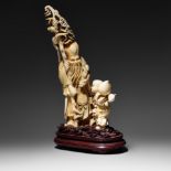 A Chinese ivory Fukurokuju mounted on a wooden base, Republic period, H 33 cm, 1340 g (+)