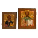 Two Russian icons depicting Christ Pantocrator and Saint Nicholas, early 19thC, 25 x 29 - 31 x 36 cm