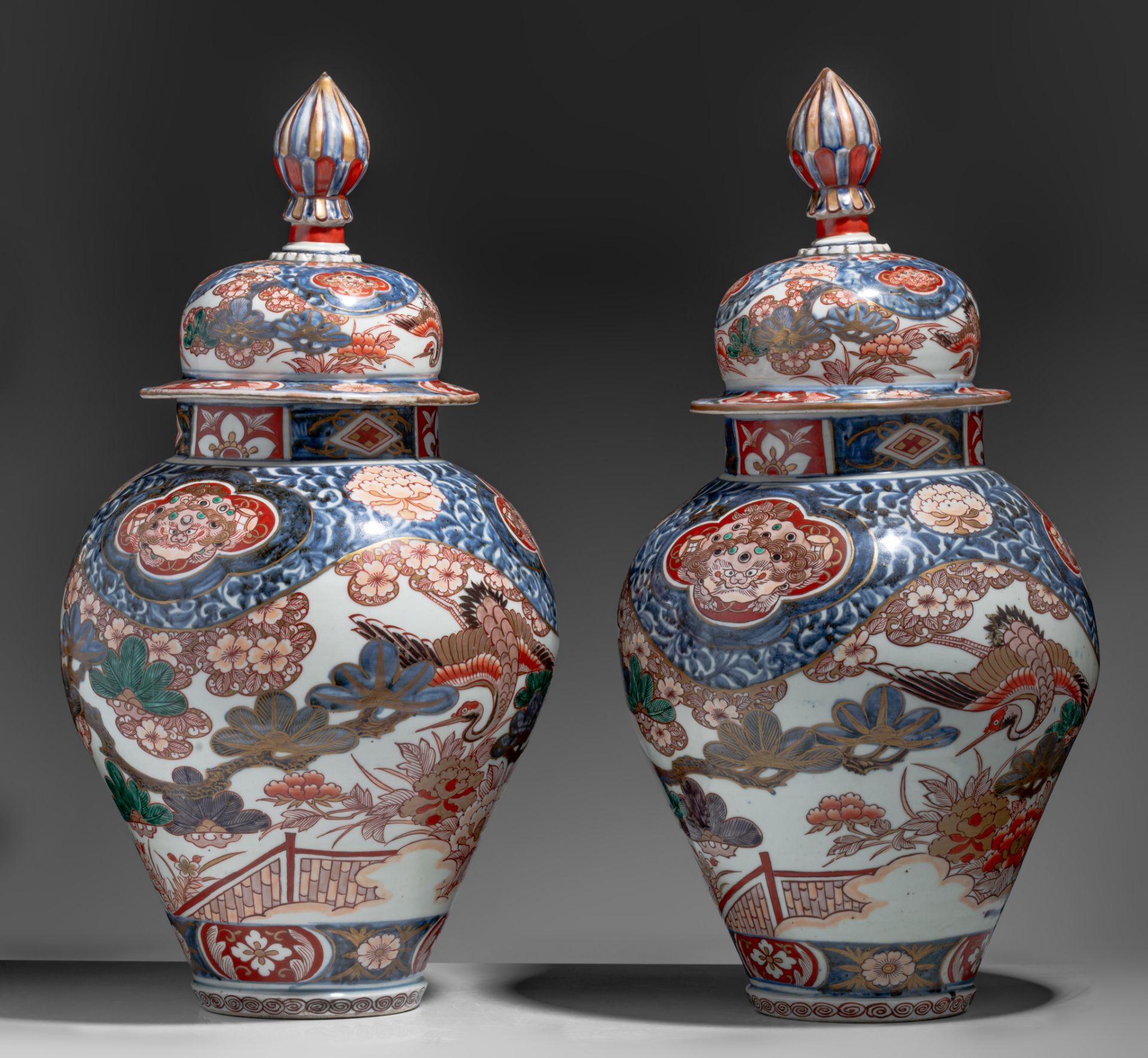 A similar pair of large Japanse Imari 'Crane' vases and covers, Edo period, late 18thC, H 64,5 cm - Image 5 of 9