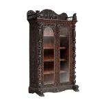 A richly carved exotic hardwood Anglo-Indian display cabinet, H 210 - W 122 - 60 cm