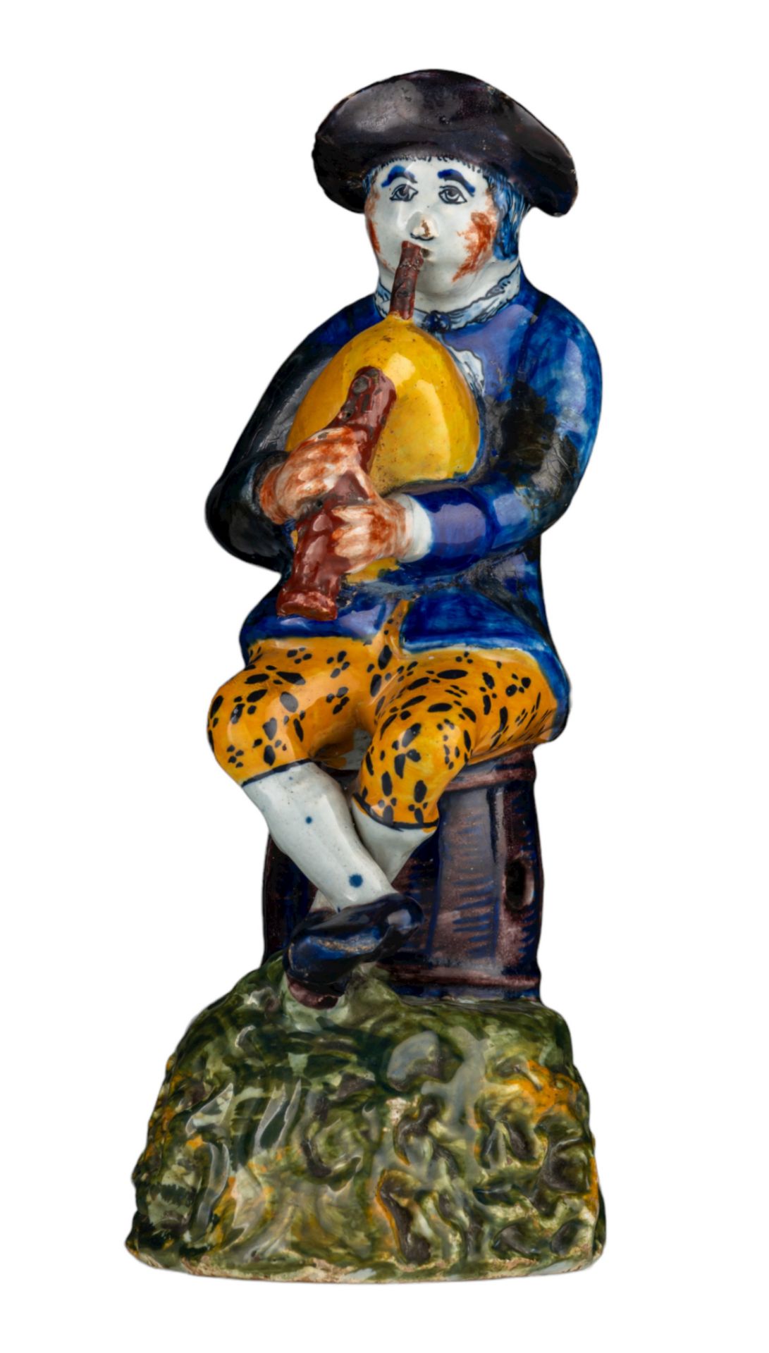 An 18thC Dutch Delft polychrome decorated figurine of a bagpiper, H 21 cm