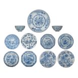 A collection of Chinese blue and white assembled dinnerware, Ming and Kangxi, largest ø 29 cm